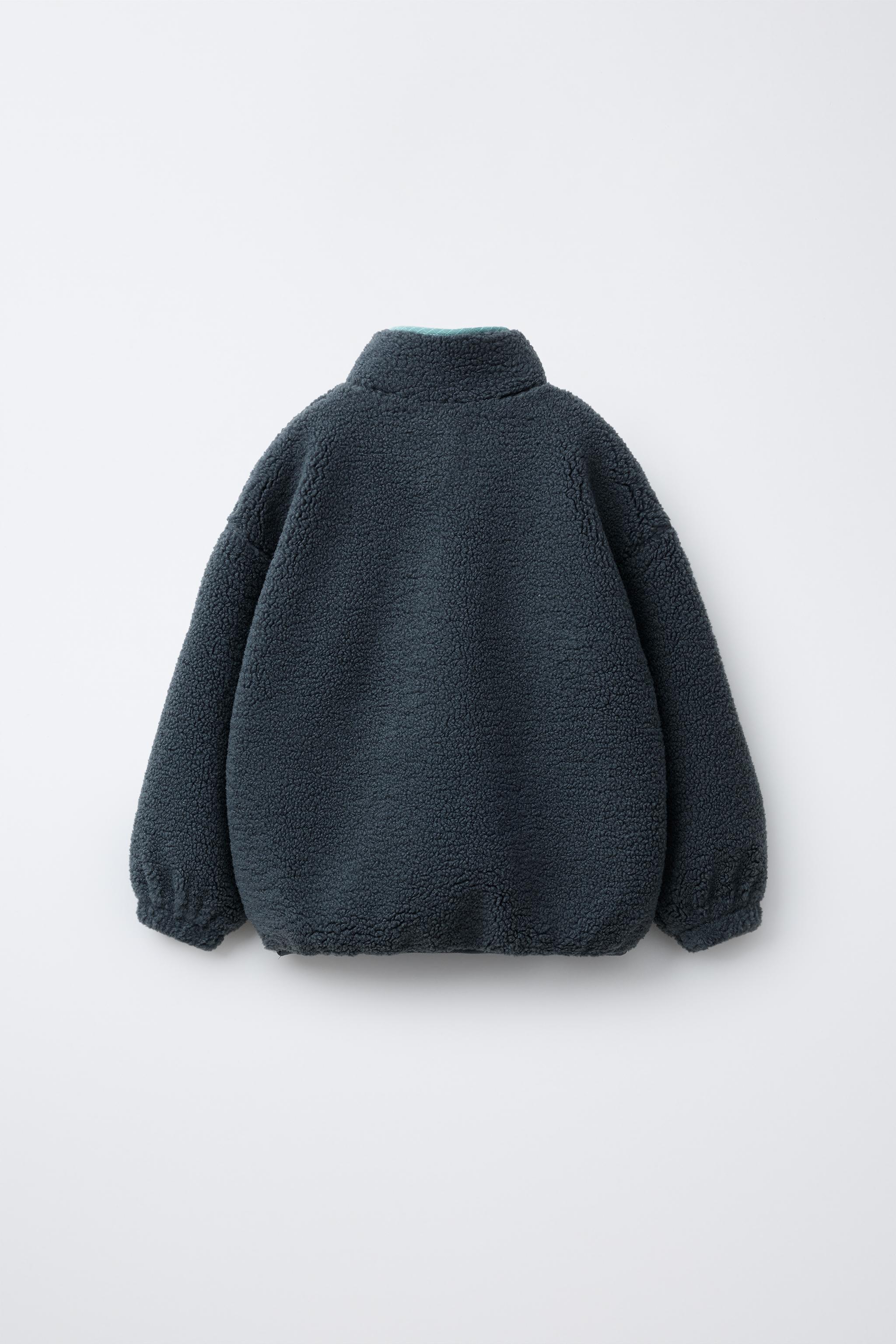 FAUX SHEARLING SWEATER WITH RUBBERIZED LOGO